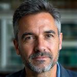 Portrait of Dr. Javier Reyes, a guest expert with a serious and thoughtful expression.